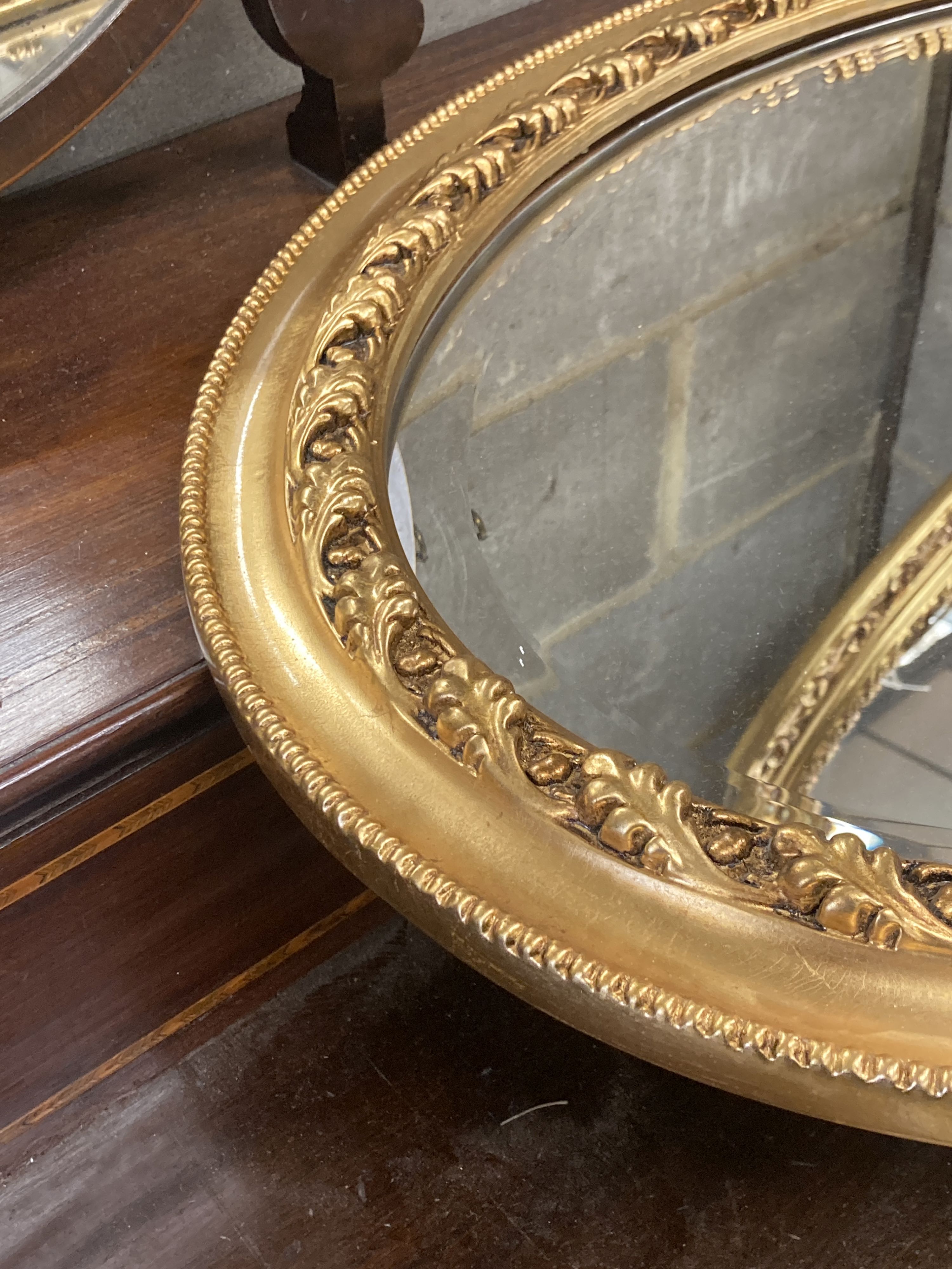 Two Victorian style oval gilt frame wall mirrors, larger 114cm, height 74cm